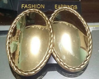 Big oval gold tone pierced earrings