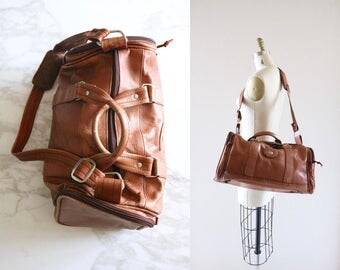 1970's rustic leather duffle bag