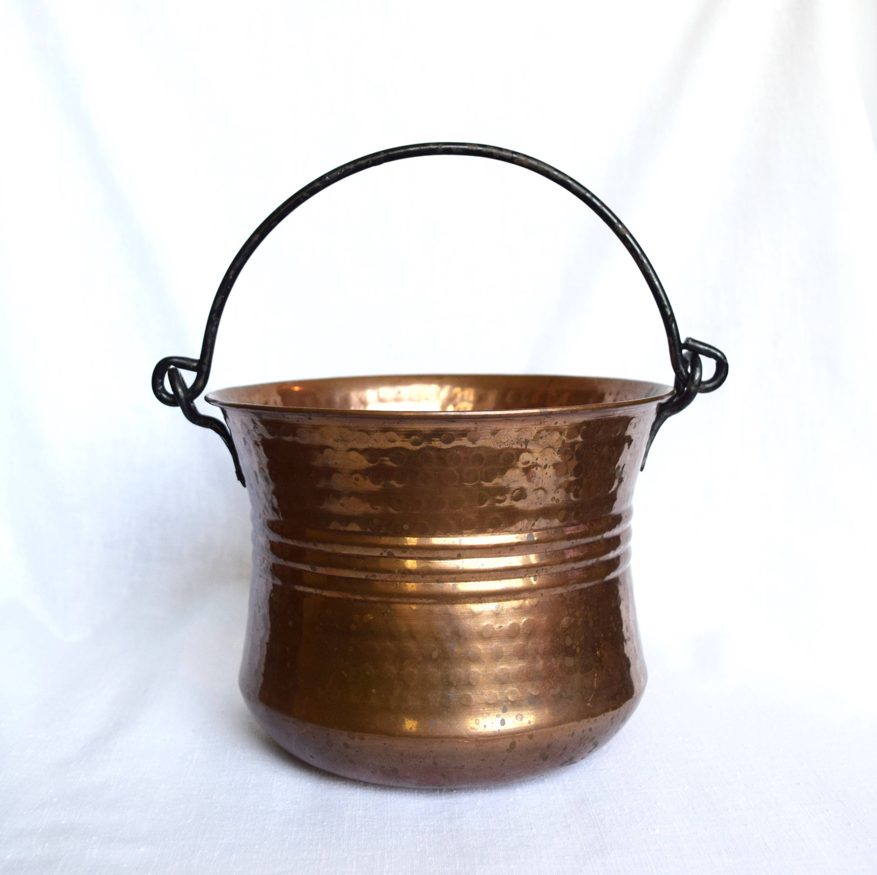 Vintage copper cauldron with cast iron handle...hammered
