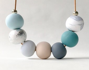 Sea green, blue and silver beaded clay necklace
