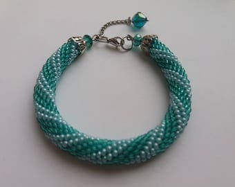 Knitted crochet bead tourniquet-bracelet on the arm