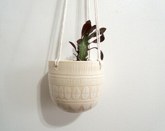 White on white geometric carved ceramic hanging planter