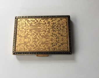 Vintage compact. Rex 5th Ave. Beautiful and elegant gold embossed compact. Still has makeup. Art Deco, from the 40's.