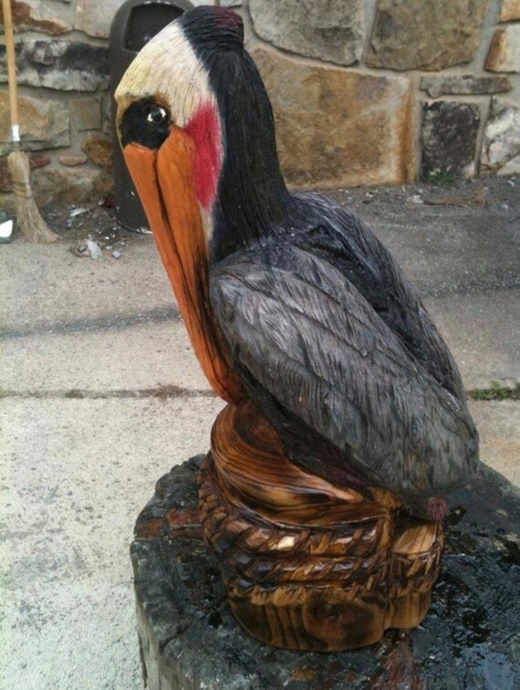 Items similar to Chainsaw carved wooden pelican one of a kind piece on Etsy