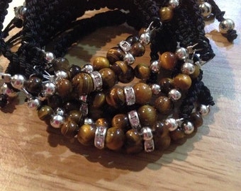 Bracelet of amethyst / eye of Tiger (stones semiprecious) e thread of macrame black