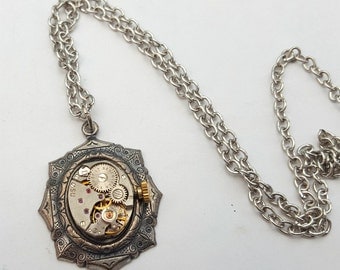 Steampunk necklace, vintage watch movement in antique silver setting on antique silver chain