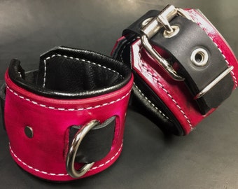 padded red and black leather wrist hand cuffs