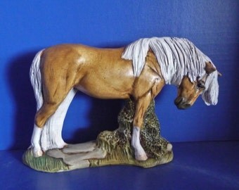 palomino horse statue