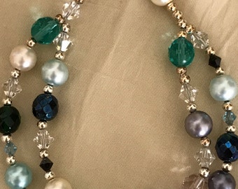 Items similar to Light green ribbon looped pearl necklace. Gold pearls ...