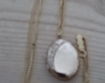 Vintage oval shaped rolled gold locket and chain