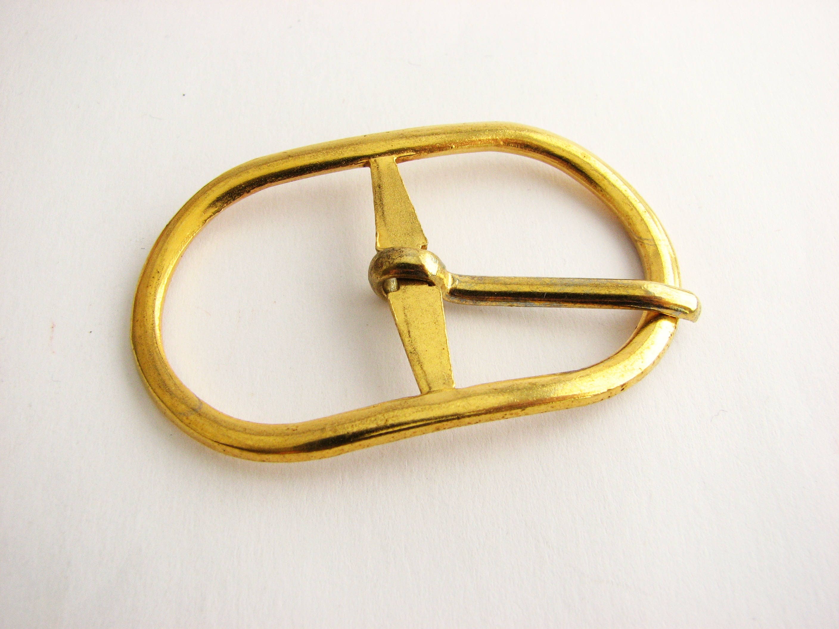 Small gold metal buckle with prong, unused golden buckle for dresses or