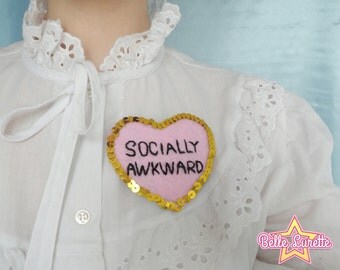 Socially awkward brooch