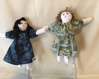 Pocket dolls,dressed in Hawaiian fabric mumu. 7" tall.