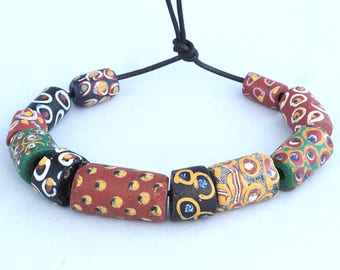 11 Antique venetian millefiori glass trade beads. African Trade