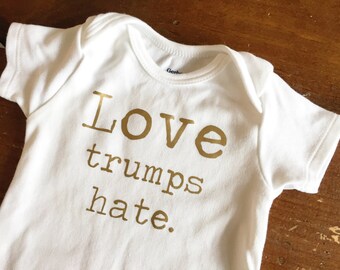 Love trumps hate. Baby Organic Onesie Bodysuit or Toddler Baseball T-shirt