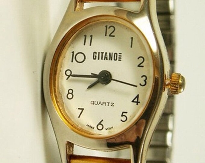 Storewide 25% Off SALE Lovely Vintage Ladies Gitano Designer Quartz Gold Tone White Dial Watch Featuring Twist-A-Flex Adjustable Band