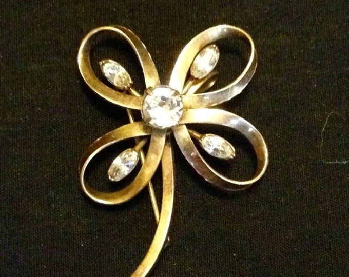 Storewide 25% Off SALE Vintage 12k Gold Four Leaf Clover Designer Brooch Featuring Beautiful Prong Set Clear Rhinestones With Elegant Curvat