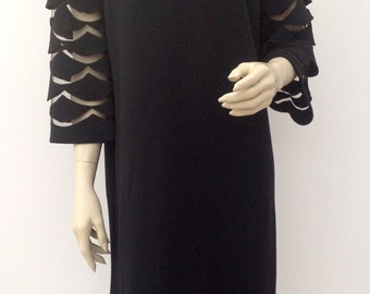 1960s dress with fabulous cut out sleeves vintage