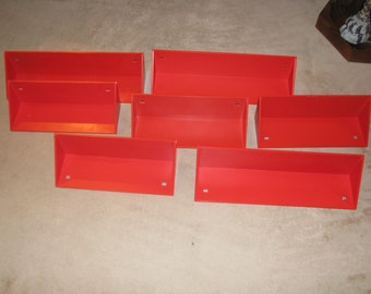 Red plastic Kartell shelves