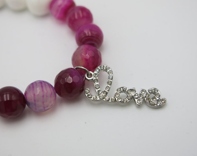 Love charm bracelet with crystal rhinestones. Show someone special how strong your love is this valentines. Love bracelet.