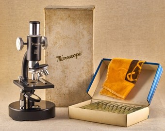 Vintage learning microscope - Vixsen P5. Vintage scientific equipment with box of prepared slides. From 80-s, Japan.