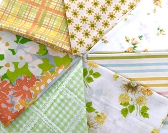 Seven vintage sheet fat quarters, yellow, orange, green, and blue