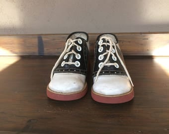 Classic Black & White Saddle Shoes with Red Rubber Soles with a Heel