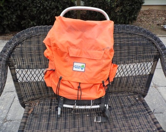 Wenzel vintage external frame backpack, orange, measures 30" long 15" wide no rips or tears in the backpack frame fabric
