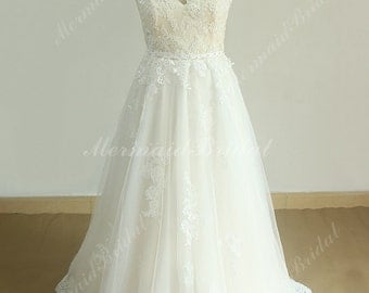 Romantic ivory a line tulle lace wedding dress with illusion neckline and pale blush lining