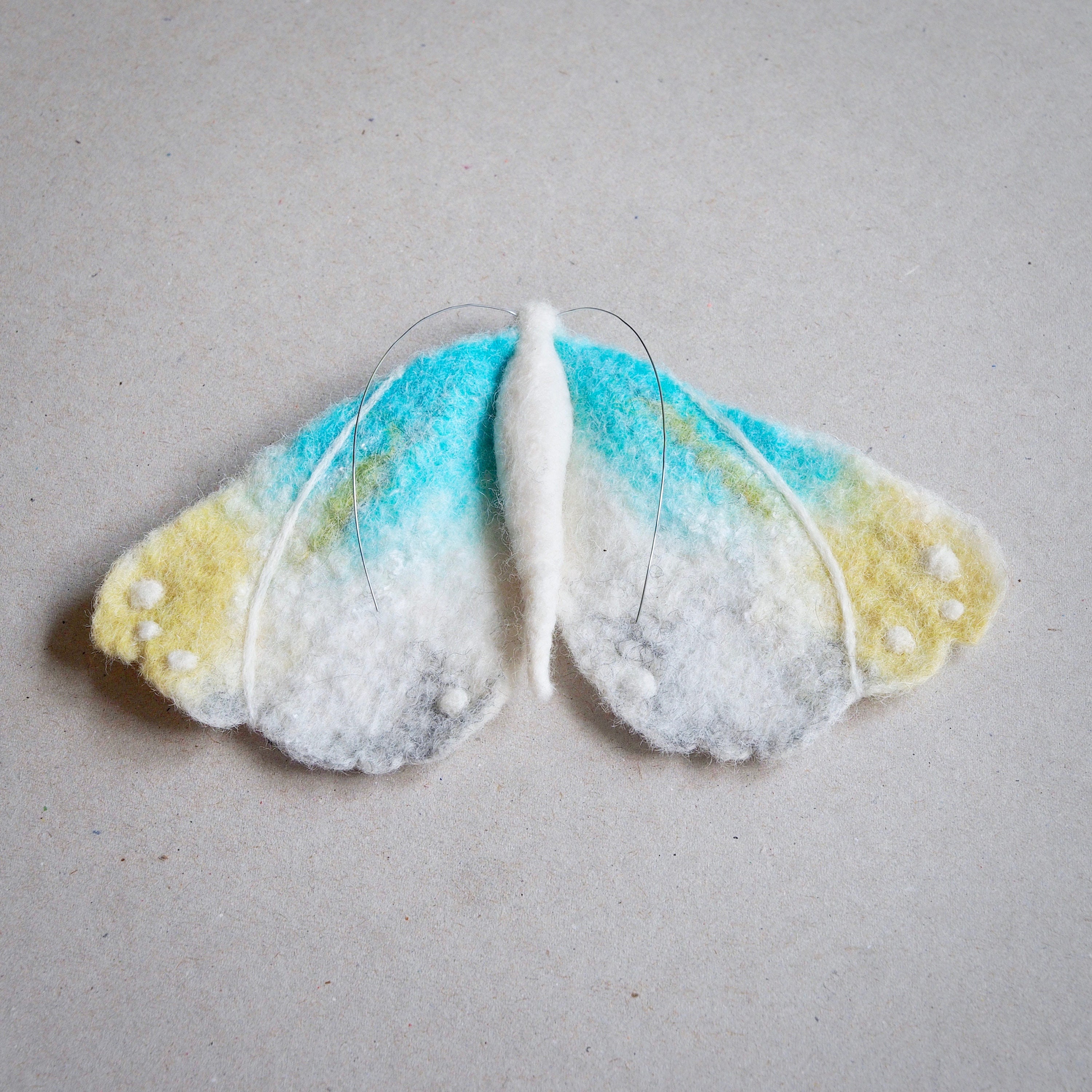 Textile moth brooch by The Lady Moth needle felted wet