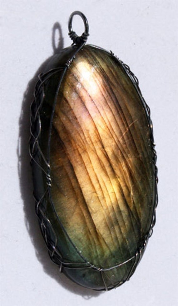 Beautiful labradorite pendant wrapped Celtic style with oxidized silver