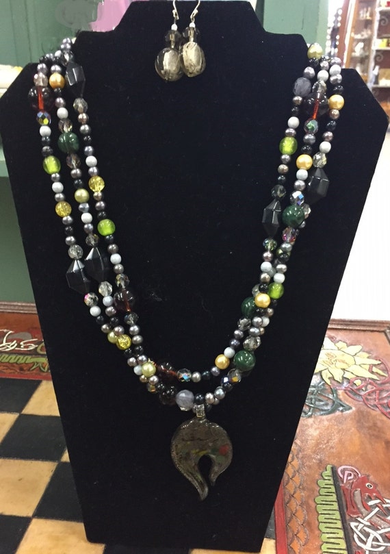 Items similar to Black, gray, green, rust necklace with a glass pendant ...