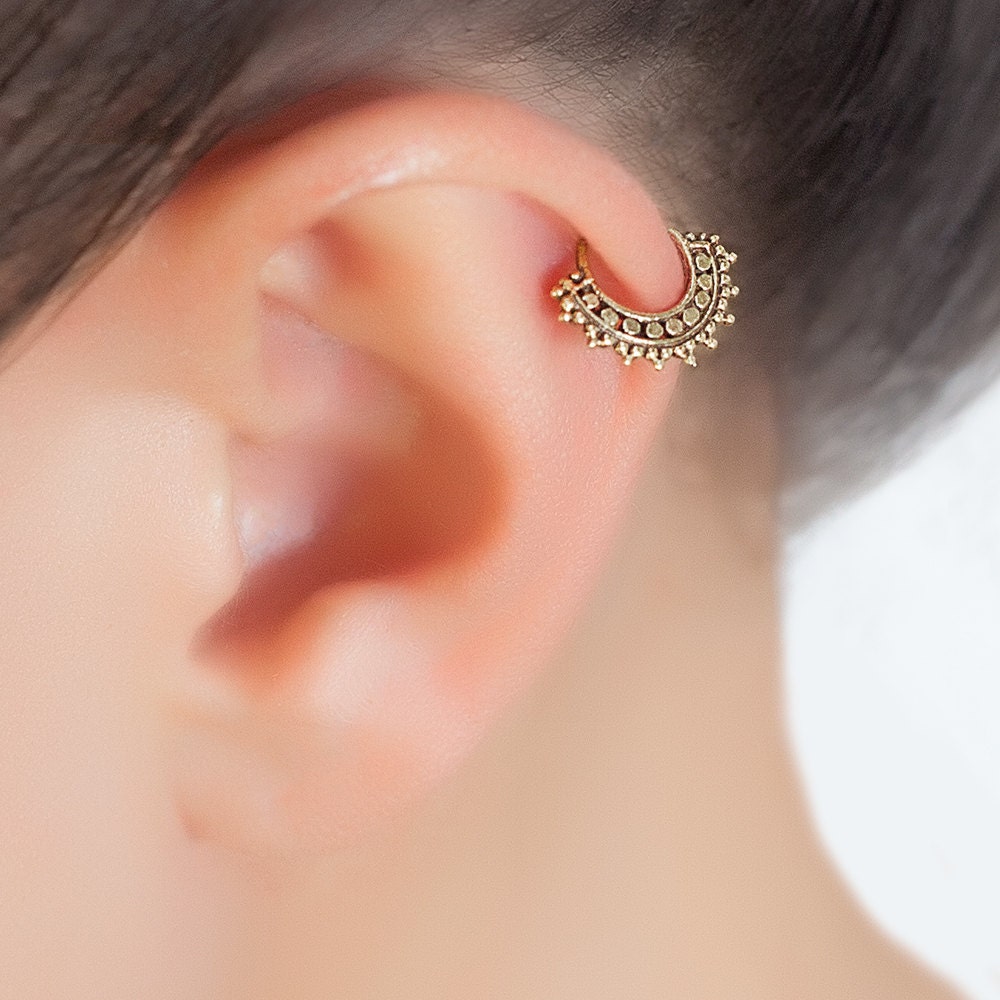 Tragus piercing. cartilage hoop. cartilage jewelry. tragus
