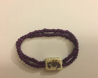 Purple Beaded Bracelet with Seahorse Bead