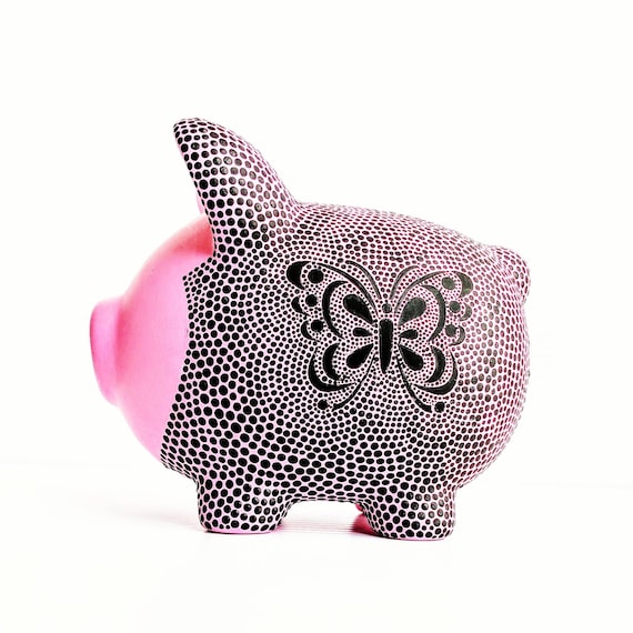 Piggy bank: pink and black piggy bank with butterfly