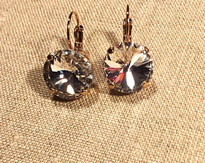 Timeless, elegant clear Swarovski crystals dangle, drop, lever back earrings with rose-gold plated prong settings and lever-back closures