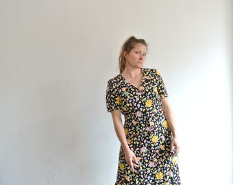 Dress by Betty Barckey in black and flower print