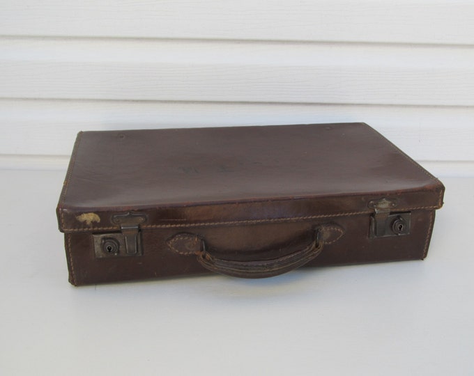 Vintage leather suitcase with travel label Major L.J.T. Weston, old English hand luggage, 1940s home storage decoration, briefcase