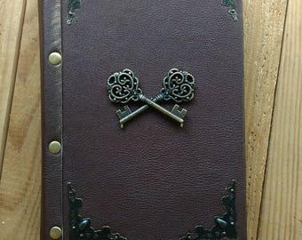 Vintage notebook with keys. Handmade.Craft sheets. Leather