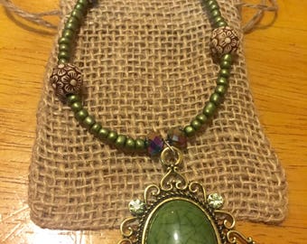 jade green pendant with beaded accents