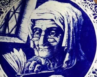 Old Woman and Book - Antique Plate by Boch La Louviere Delfts