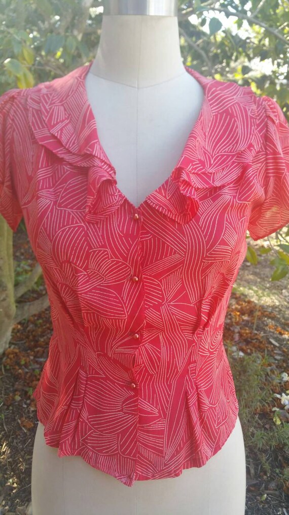 80's deco meets Hawaiian blouse with flutter sleeves