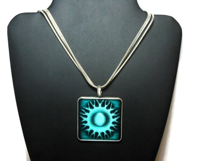 Southwest sun pendant, blue green square, epoxy sun in a pewter frame, silver plated chain, three strand, decorative clasp