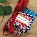 Festive Liberty fabric garland with secret message 'LOVE & JOY' - cosy Christmas colours - Christmas Liberty bunting - red and green
