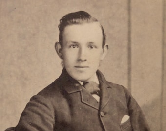 Carte-de-visite, antique. Featuring a seated young man. Israel Todd, Otley, (W. Yorks). c 1890's.