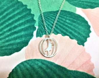 Silver bird in a cage pendant necklace