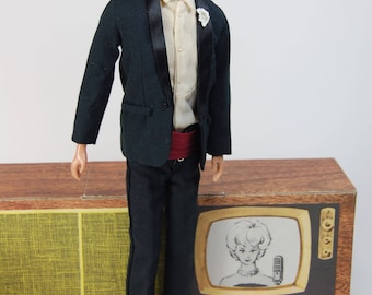 Vintage Ken black flocked hair first issue Mattel doll wearing number 787 Tuxedo black suit cummerbund shoes