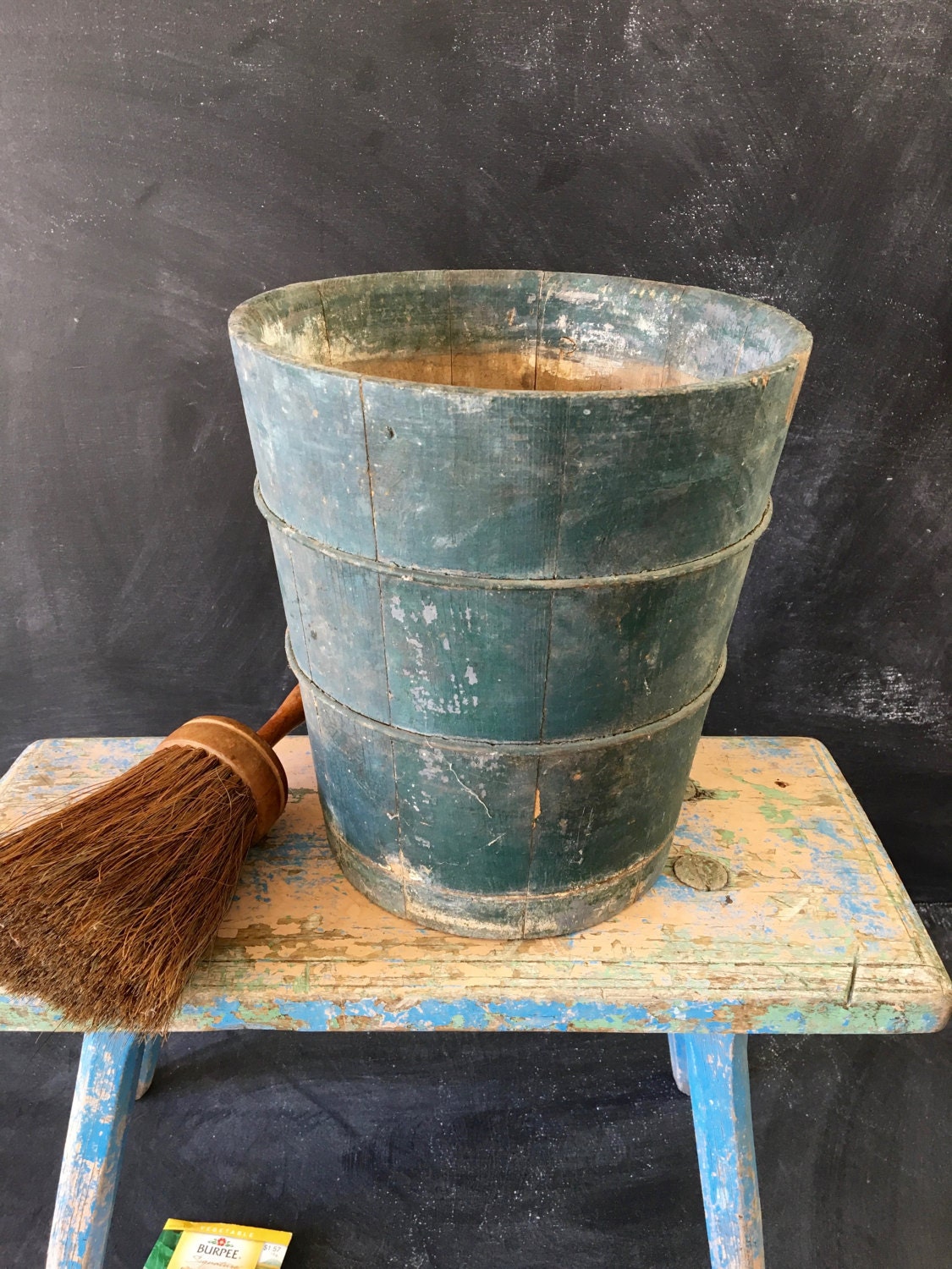 Rustic primitive wooden bucket with old blue paintfarmhouse
