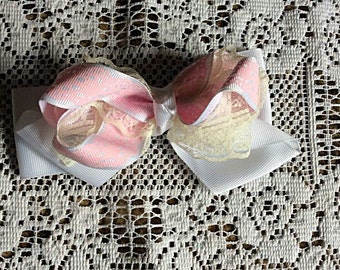 One (1) Creme, White, and Pink Bow Hair Clip