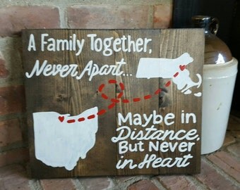 State to State A family together never apart maybe in distance but never in heart wood sign